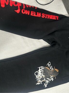PALACE Black Sweatpants with Red Sleeve 'On Elm Street' Print